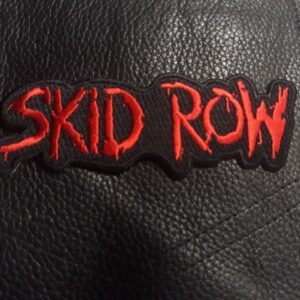 Нашивка Skid Row с червено бродирано лого върху черна кожа.