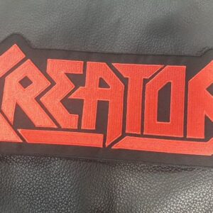 Бродирана нашивка за гръб Kreator с червено лого върху черна основа.