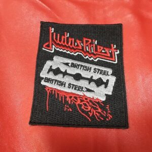 Бродирана нашивка Judas Priest British Steel с дизайн на бръснарско ножче върху черна основа.