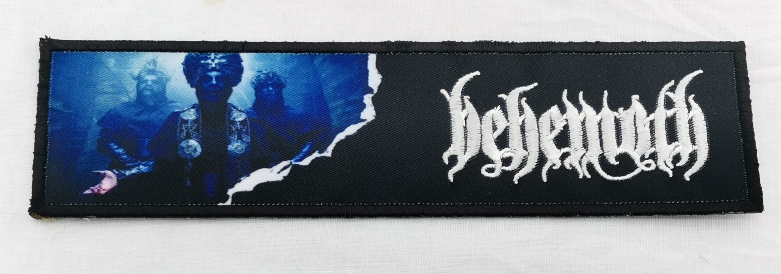 Черна нашивка за дрехи Behemoth с бяло лого и синьо изображение.