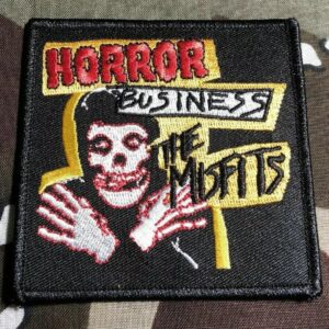 Нашивка на Misfits с Crimson Ghost и цветен надпис Horror Business върху черен фон.