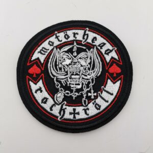 Кръгла текстилна нашивка Motörhead с логото Snaggletooth и червени пики.